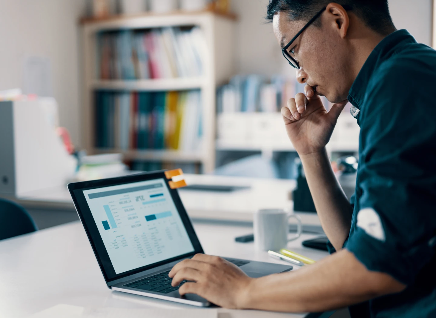 Modern glass buildings with numbers overlay, symbolizing finance, data, and accounting practices.