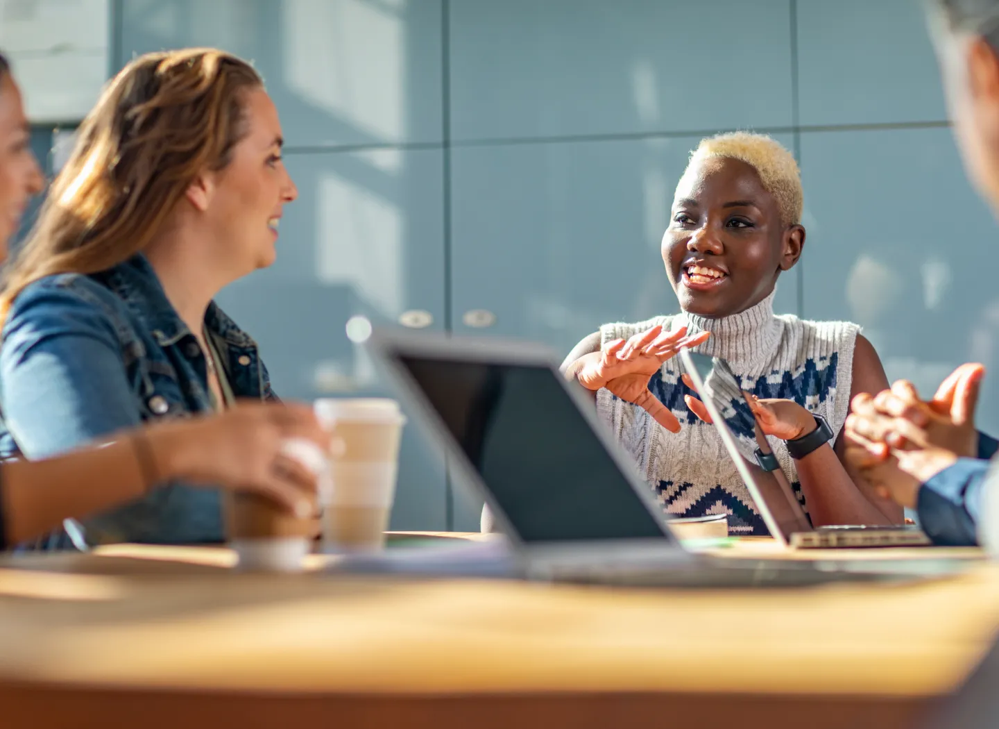 Business team in a meeting as a leader presents charts, highlighting management, strategy, and decision-making skills.